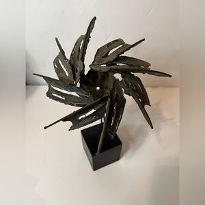 Abstract Metal Sculpture on a Black Base signed by "Guy"